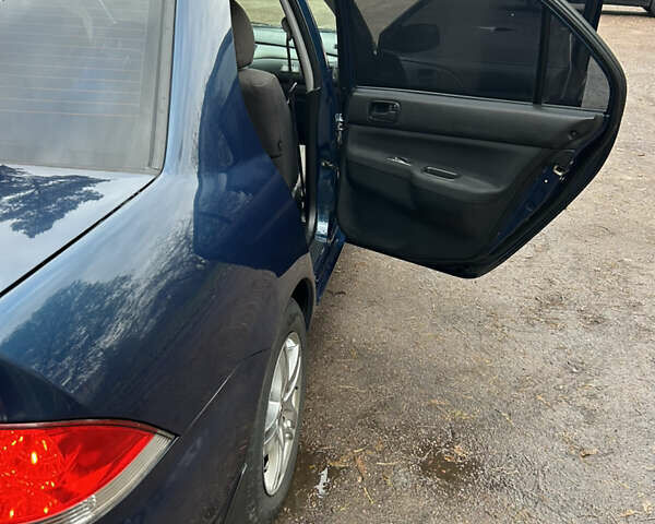 Синий Мицубиси Лансер, объемом двигателя 1.6 л и пробегом 150 тыс. км за 5700 $, фото 40 на Automoto.ua