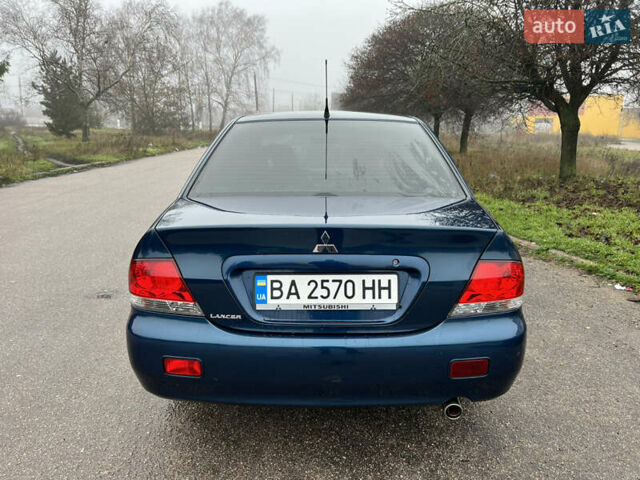 Синий Мицубиси Лансер, объемом двигателя 1.59 л и пробегом 126 тыс. км за 5950 $, фото 5 на Automoto.ua