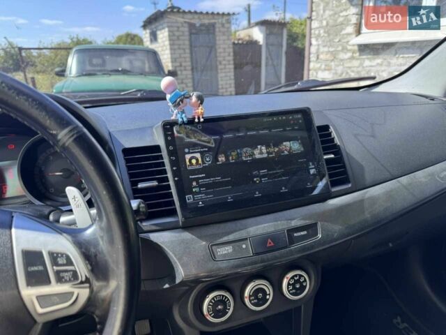 Синій Міцубісі Lancer, об'ємом двигуна 2 л та пробігом 300 тис. км за 5800 $, фото 9 на Automoto.ua