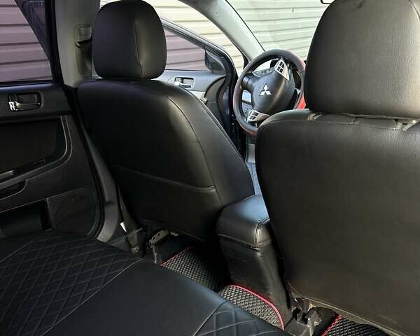 Синий Мицубиси Лансер, объемом двигателя 1.97 л и пробегом 260 тыс. км за 6000 $, фото 6 на Automoto.ua