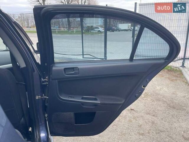 Синий Мицубиси Лансер, объемом двигателя 2 л и пробегом 142 тыс. км за 8000 $, фото 17 на Automoto.ua