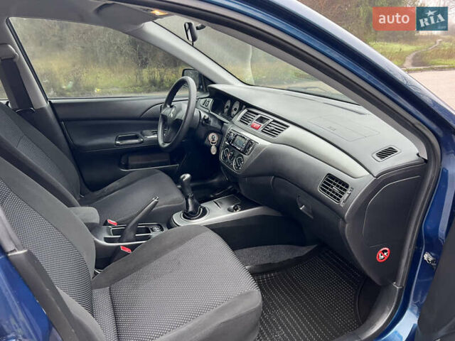 Синий Мицубиси Лансер, объемом двигателя 1.59 л и пробегом 126 тыс. км за 5950 $, фото 11 на Automoto.ua