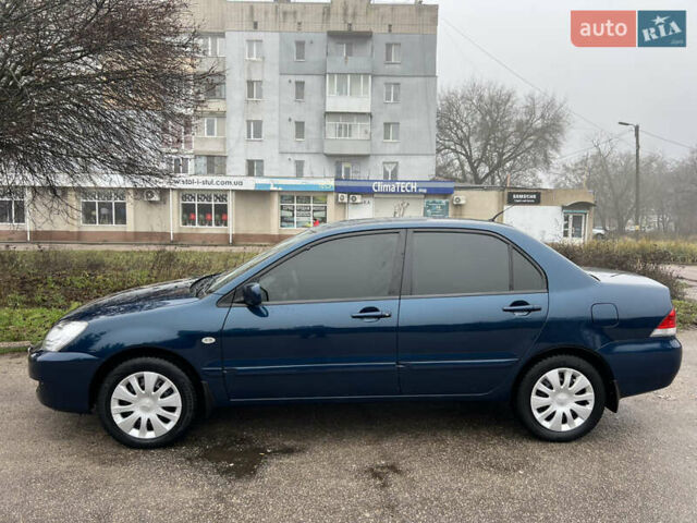 Синий Мицубиси Лансер, объемом двигателя 1.59 л и пробегом 126 тыс. км за 5950 $, фото 3 на Automoto.ua