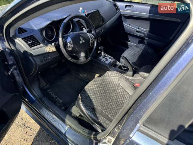 Синій Міцубісі Lancer, об'ємом двигуна 2 л та пробігом 299 тис. км за 7100 $, фото 9 на Automoto.ua
