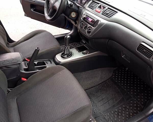 Синій Міцубісі Lancer, об'ємом двигуна 1.6 л та пробігом 206 тис. км за 5500 $, фото 4 на Automoto.ua