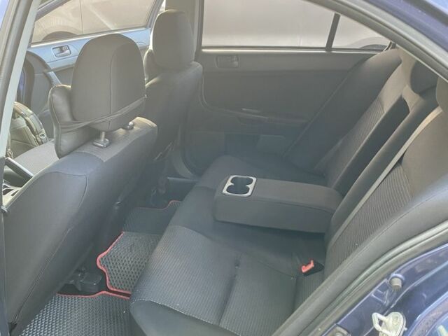 Синий Мицубиси Лансер, объемом двигателя 1.5 л и пробегом 247 тыс. км за 5000 $, фото 7 на Automoto.ua