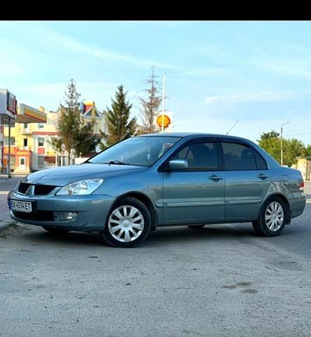 Синий Мицубиси Лансер, объемом двигателя 1.6 л и пробегом 200 тыс. км за 5000 $, фото 1 на Automoto.ua