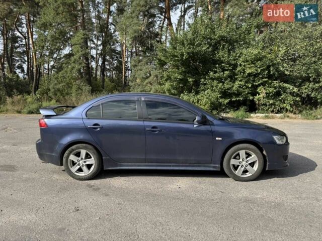 Синій Міцубісі Lancer, об'ємом двигуна 2 л та пробігом 300 тис. км за 5800 $, фото 7 на Automoto.ua