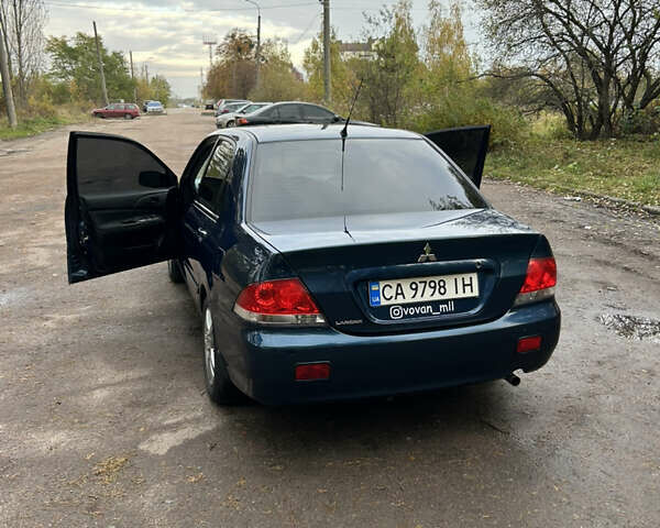 Синий Мицубиси Лансер, объемом двигателя 1.6 л и пробегом 150 тыс. км за 5700 $, фото 2 на Automoto.ua