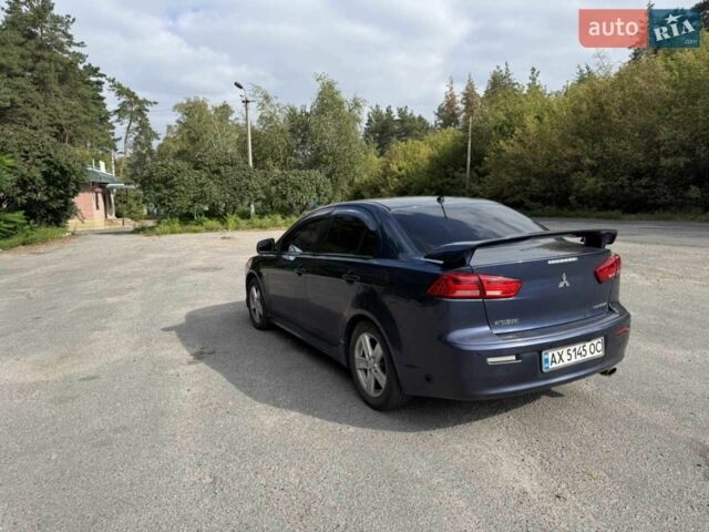 Синій Міцубісі Lancer, об'ємом двигуна 2 л та пробігом 300 тис. км за 5800 $, фото 4 на Automoto.ua