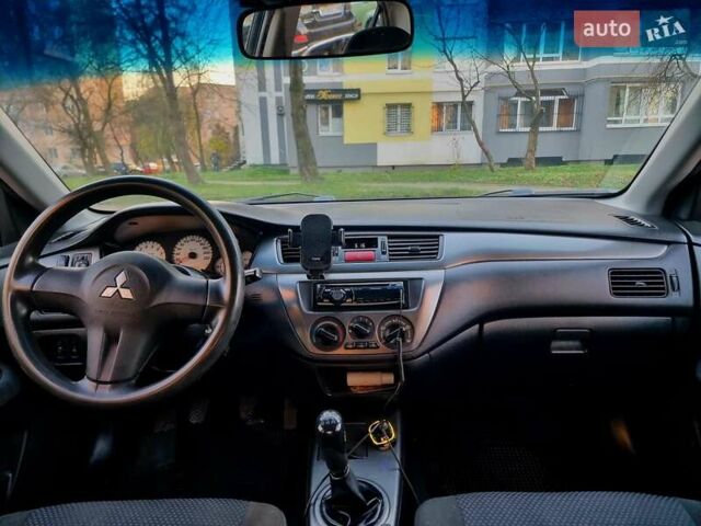 Синій Міцубісі Lancer, об'ємом двигуна 1.6 л та пробігом 298 тис. км за 2998 $, фото 1 на Automoto.ua