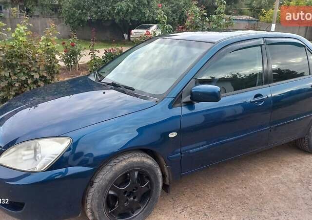 Синій Міцубісі Lancer, об'ємом двигуна 1.58 л та пробігом 220 тис. км за 4200 $, фото 7 на Automoto.ua