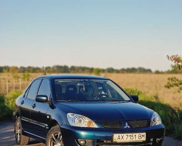 Синий Мицубиси Лансер, объемом двигателя 1.6 л и пробегом 197 тыс. км за 6500 $, фото 1 на Automoto.ua