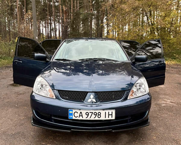 Синий Мицубиси Лансер, объемом двигателя 1.6 л и пробегом 150 тыс. км за 5700 $, фото 24 на Automoto.ua