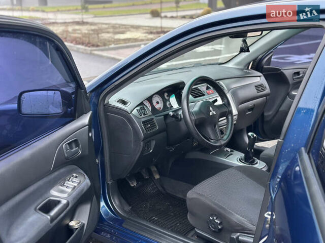 Синий Мицубиси Лансер, объемом двигателя 1.6 л и пробегом 187 тыс. км за 3799 $, фото 15 на Automoto.ua