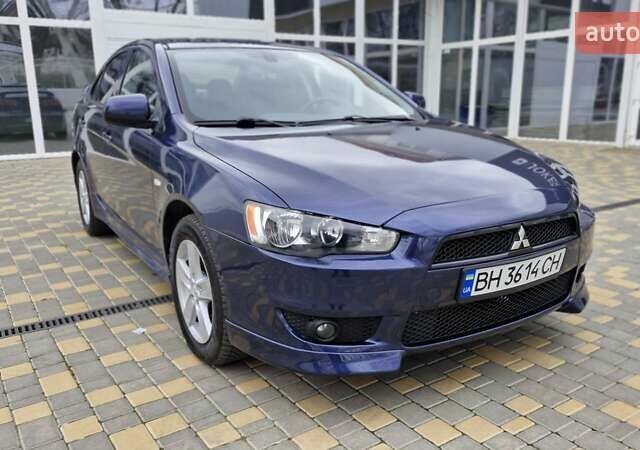 Синий Мицубиси Лансер, объемом двигателя 2 л и пробегом 186 тыс. км за 7200 $, фото 1 на Automoto.ua