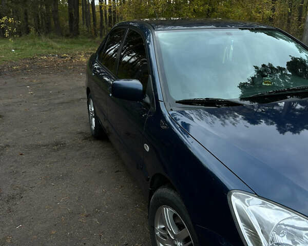 Синий Мицубиси Лансер, объемом двигателя 1.6 л и пробегом 150 тыс. км за 5700 $, фото 56 на Automoto.ua