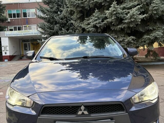 Синий Мицубиси Лансер, объемом двигателя 2 л и пробегом 205 тыс. км за 5899 $, фото 1 на Automoto.ua