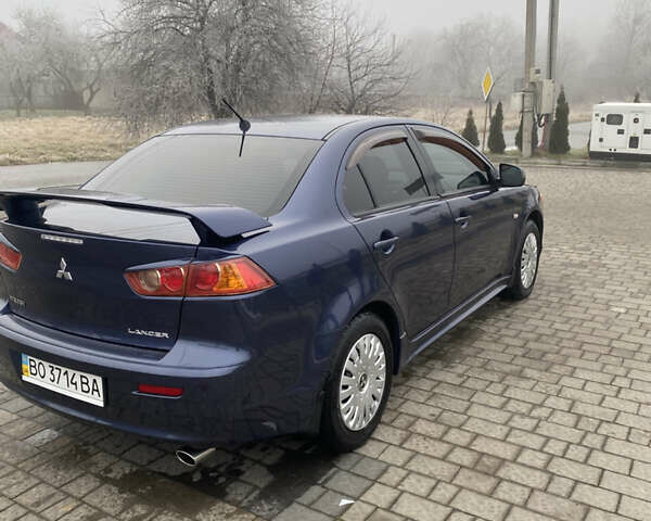 Синий Мицубиси Лансер, объемом двигателя 2 л и пробегом 230 тыс. км за 6500 $, фото 3 на Automoto.ua