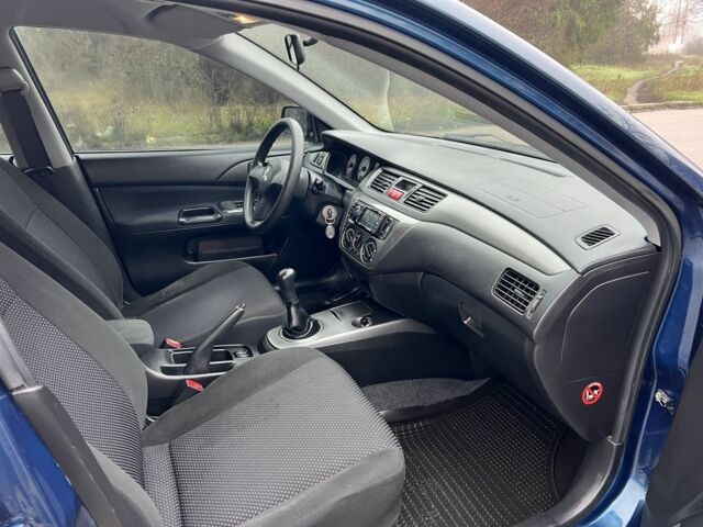 Синій Міцубісі Lancer, об'ємом двигуна 1.6 л та пробігом 126 тис. км за 5950 $, фото 11 на Automoto.ua