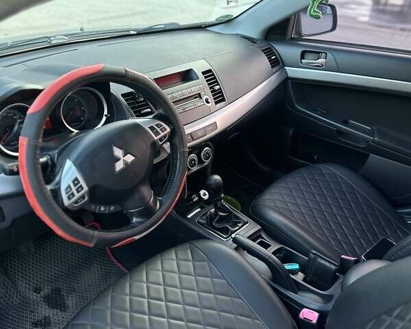 Синий Мицубиси Лансер, объемом двигателя 1.97 л и пробегом 260 тыс. км за 6000 $, фото 8 на Automoto.ua