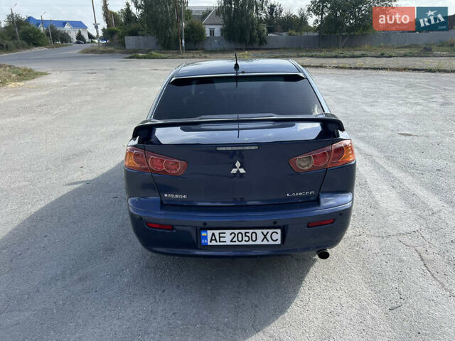 Синий Мицубиси Лансер, объемом двигателя 2 л и пробегом 248 тыс. км за 6600 $, фото 37 на Automoto.ua