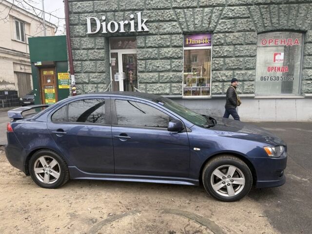 Синий Мицубиси Лансер, объемом двигателя 2 л и пробегом 200 тыс. км за 6700 $, фото 3 на Automoto.ua