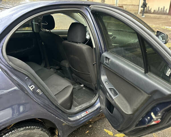 Міцубісі Lancer 2008 у Южноукраинске на Automoto.ua Синій Міцубісі Lancer, об'ємом двигуна 1.5 л та пробігом 176 тис. км за 5200 $, фото 7 на Automoto.ua
