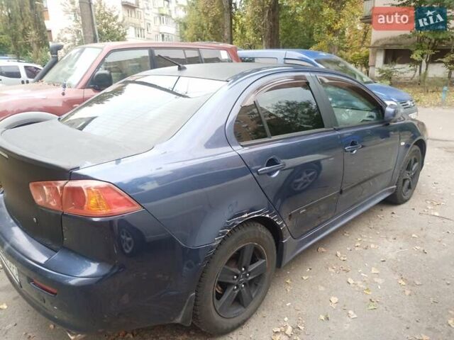 Синій Міцубісі Lancer, об'ємом двигуна 2 л та пробігом 265 тис. км за 5700 $, фото 1 на Automoto.ua