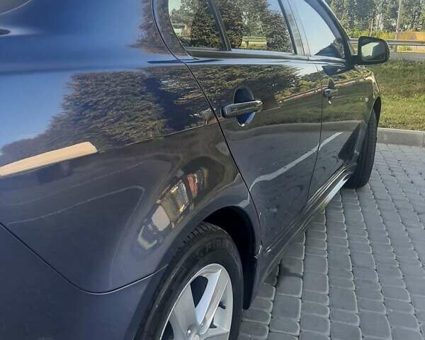 Синий Мицубиси Лансер, объемом двигателя 2 л и пробегом 142 тыс. км за 8000 $, фото 7 на Automoto.ua