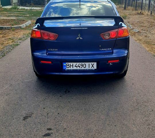 Синій Міцубісі Lancer, об'ємом двигуна 2 л та пробігом 242 тис. км за 5300 $, фото 4 на Automoto.ua