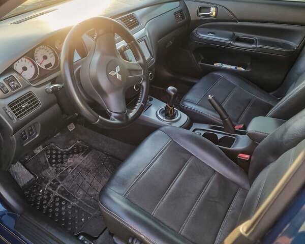 Синий Мицубиси Лансер, объемом двигателя 1.6 л и пробегом 197 тыс. км за 6500 $, фото 9 на Automoto.ua