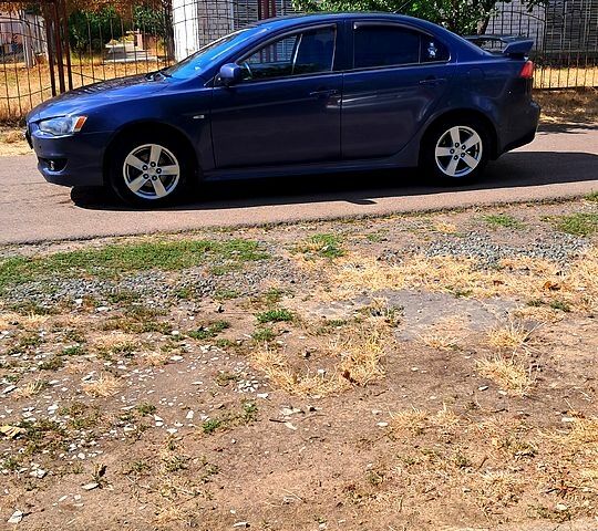 Синій Міцубісі Lancer, об'ємом двигуна 2 л та пробігом 242 тис. км за 5300 $, фото 6 на Automoto.ua