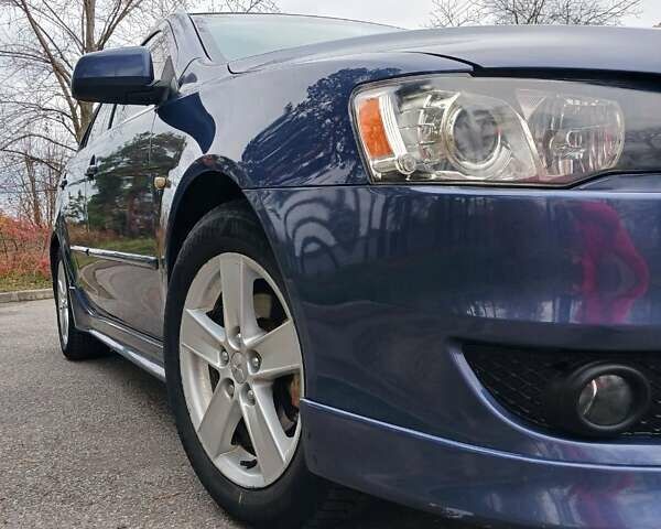 Синий Мицубиси Лансер, объемом двигателя 1.5 л и пробегом 220 тыс. км за 6999 $, фото 24 на Automoto.ua