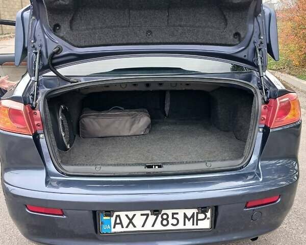 Синий Мицубиси Лансер, объемом двигателя 1.5 л и пробегом 220 тыс. км за 6999 $, фото 12 на Automoto.ua