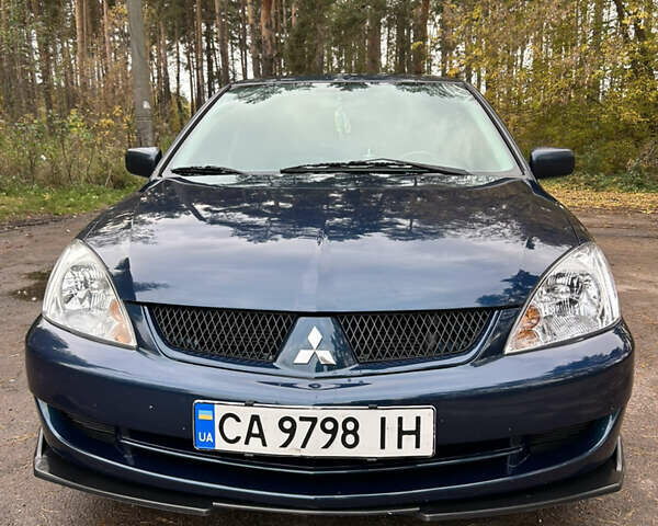 Синий Мицубиси Лансер, объемом двигателя 1.6 л и пробегом 150 тыс. км за 5700 $, фото 10 на Automoto.ua