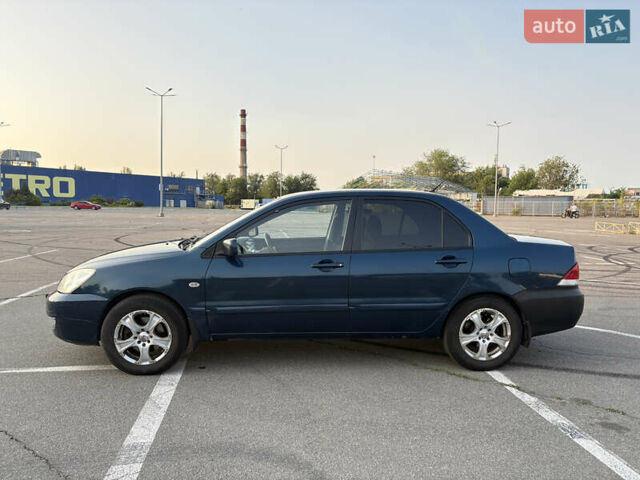 Синій Міцубісі Lancer, об'ємом двигуна 1.58 л та пробігом 167 тис. км за 5700 $, фото 3 на Automoto.ua