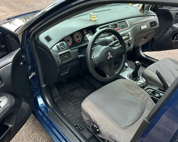 Синий Мицубиси Лансер, объемом двигателя 1.6 л и пробегом 150 тыс. км за 5700 $, фото 30 на Automoto.ua