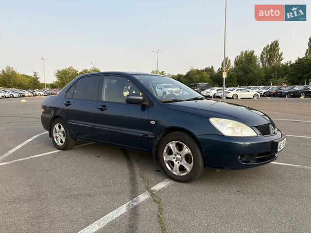 Синій Міцубісі Lancer, об'ємом двигуна 1.58 л та пробігом 167 тис. км за 5700 $, фото 8 на Automoto.ua