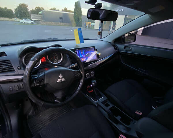 Синий Мицубиси Лансер, объемом двигателя 2 л и пробегом 280 тыс. км за 6900 $, фото 7 на Automoto.ua