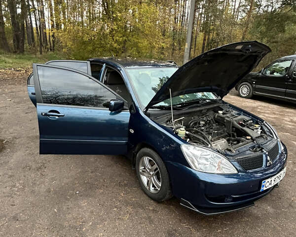 Синий Мицубиси Лансер, объемом двигателя 1.6 л и пробегом 150 тыс. км за 5700 $, фото 12 на Automoto.ua