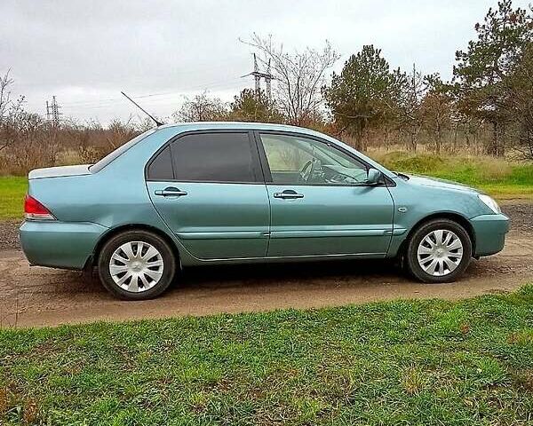 Синий Мицубиси Лансер, объемом двигателя 1.6 л и пробегом 167 тыс. км за 4700 $, фото 5 на Automoto.ua