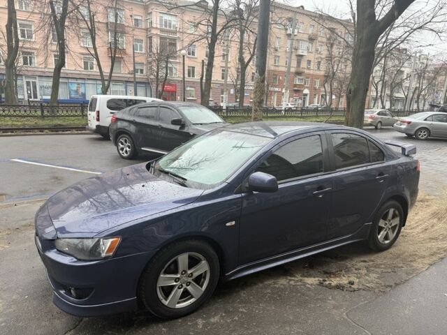 Синий Мицубиси Лансер, объемом двигателя 2 л и пробегом 200 тыс. км за 6700 $, фото 5 на Automoto.ua