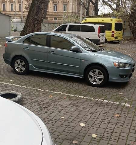 Синий Мицубиси Лансер, объемом двигателя 2 л и пробегом 300 тыс. км за 6900 $, фото 1 на Automoto.ua