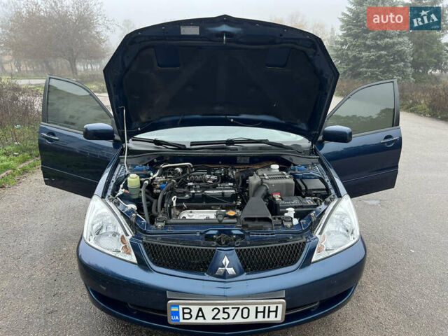Синий Мицубиси Лансер, объемом двигателя 1.59 л и пробегом 126 тыс. км за 5950 $, фото 8 на Automoto.ua