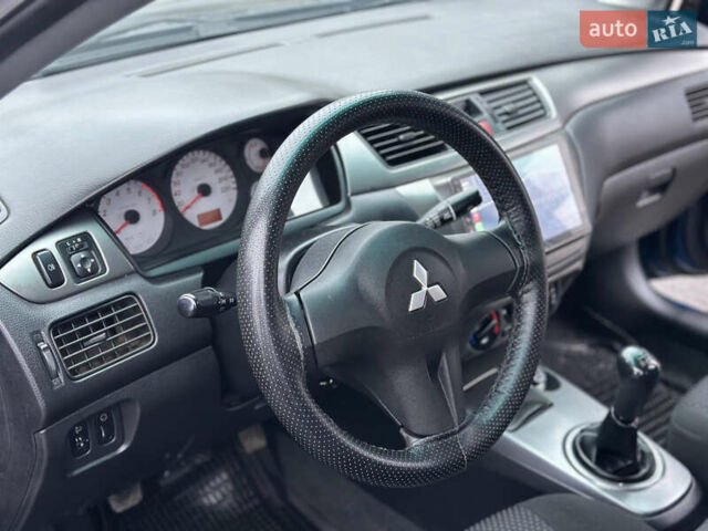 Синий Мицубиси Лансер, объемом двигателя 1.6 л и пробегом 187 тыс. км за 3799 $, фото 17 на Automoto.ua