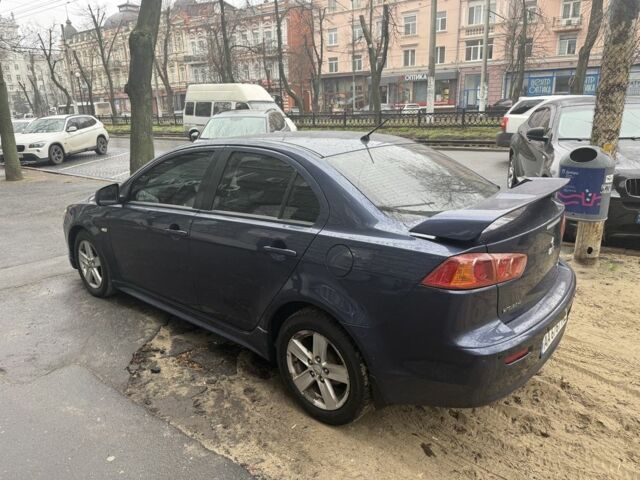 Синий Мицубиси Лансер, объемом двигателя 2 л и пробегом 200 тыс. км за 6700 $, фото 6 на Automoto.ua