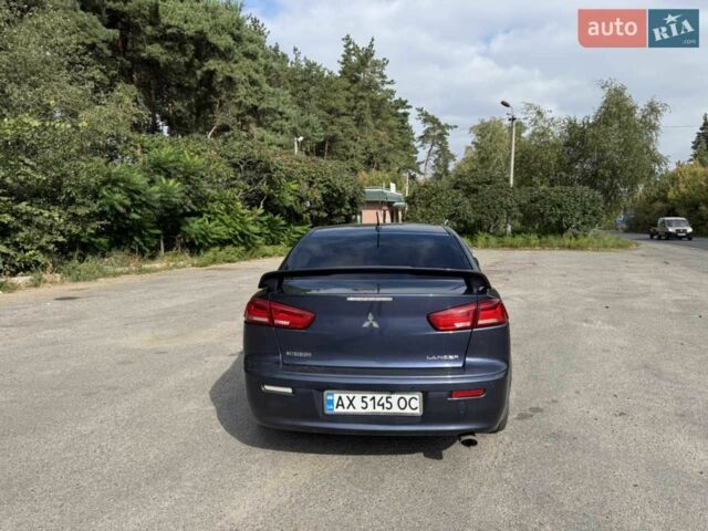 Синій Міцубісі Lancer, об'ємом двигуна 2 л та пробігом 300 тис. км за 5800 $, фото 5 на Automoto.ua