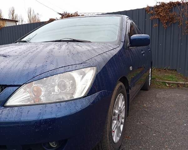 Синій Міцубісі Lancer, об'ємом двигуна 1.6 л та пробігом 206 тис. км за 5500 $, фото 5 на Automoto.ua