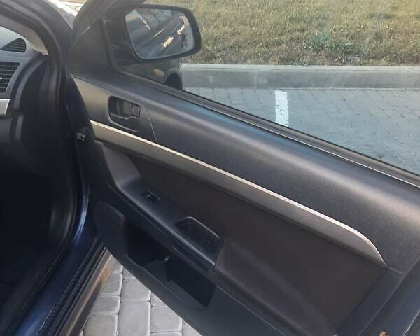Синий Мицубиси Лансер, объемом двигателя 2 л и пробегом 142 тыс. км за 8000 $, фото 9 на Automoto.ua